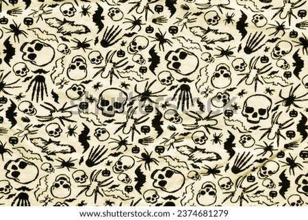 Halloween holiday concept. Halloween decorations, skeleton hands, bats, skulls, spiders on a white background. Flat lay, top view.