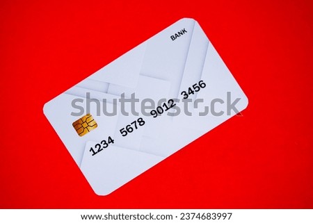 A gray card which is a very rare one pictured on a red background, the card is a pocket where we can keep money online.