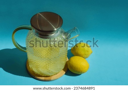 water with lemon. a healthy refreshing summer drink, lemonade. background for the design.