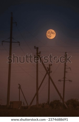 last summer moon 2023 and Electricity poles at sunset