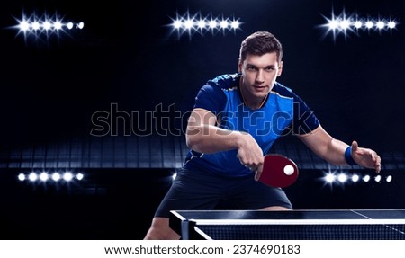 Table tennis player on the black background. Ping pong banner. Download a photo of a table tennis player for a tenis racket packaging design. Image for tennis ball box template. Royalty-Free Stock Photo #2374690183