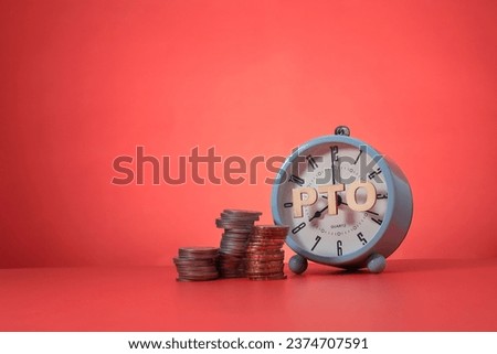 Conceptual idea on PTO or Paid Time Off. The letter PTO on the alarm clock face and stacked coins isolated on red background Royalty-Free Stock Photo #2374707591