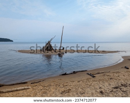 Teepee structure made of wood of Sand Coast Beach in Munising Michigan