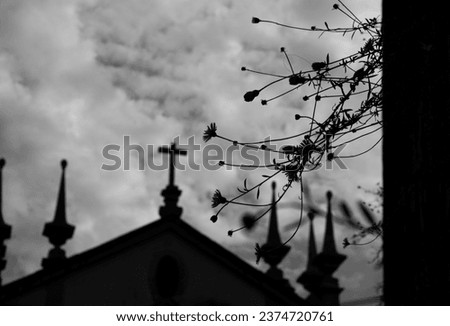 Cross of church and flowers silhouettes