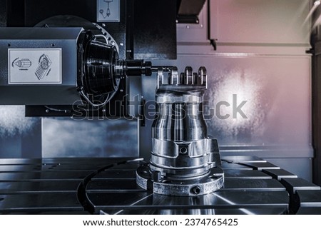 Metalworking CNC lathe milling machine. Cutting metal modern processing technology. Milling is the process of machining using rotary cutters to remove material by advancing a cutter into a workpiece. Royalty-Free Stock Photo #2374765425