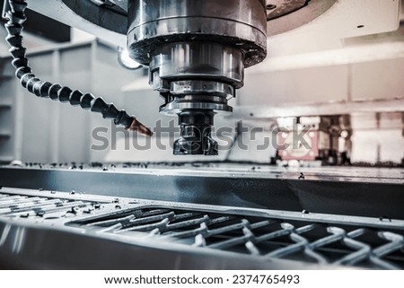 Metalworking CNC lathe milling machine. Cutting metal modern processing technology. Milling is the process of machining using rotary cutters to remove material by advancing a cutter into a workpiece. Royalty-Free Stock Photo #2374765493