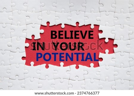Potential symbol. Concept word Believe in your Potential on white puzzle. Beautiful red background. Business and Believe in your Potential concept. Copy space Royalty-Free Stock Photo #2374766377