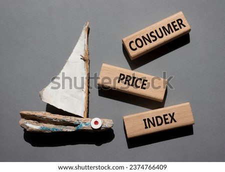 Consumer Price Index symbol. Concept words Consumer Price Index on wooden blocks. Beautiful grey background with boat. Business and Consumer Price Index concept. Copy space.
