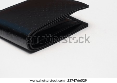 Black wallet for men, stylish and attractive. Like leather, synthetic material. Isolated white.