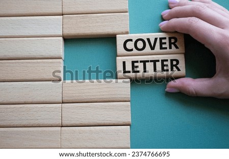 Cover Letter symbol. Concept word Cover Letter on wooden blocks. Businessman hand. Beautiful grey green background. Business and Cover Letter concept. Copy space