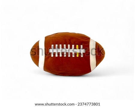 Rugby ball doll on white background