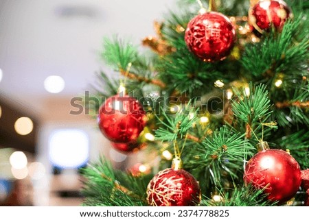 Luxury red christmas ball ornament hanging on pine tree
