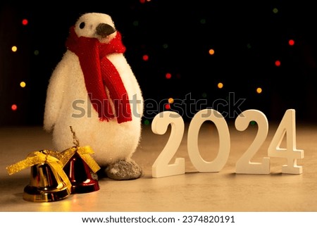 Penguin with red scarf christmas bells 2024