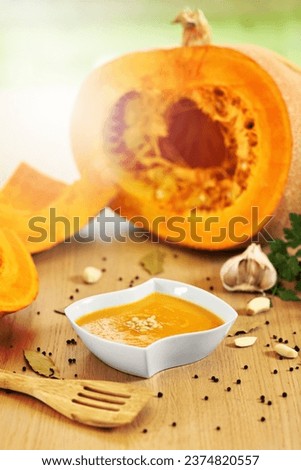 Picture showing pumpkin creamy soup with pinia nuts