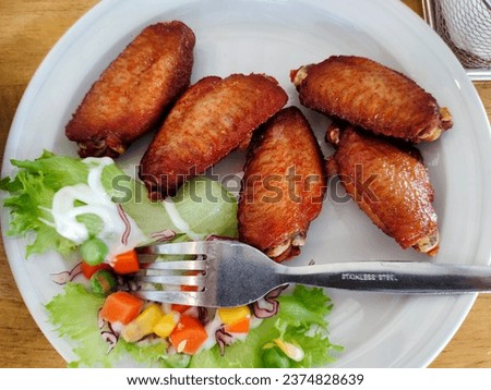 Fried chicken wings as picture for photo and background. Beauty very nice food for take photo.