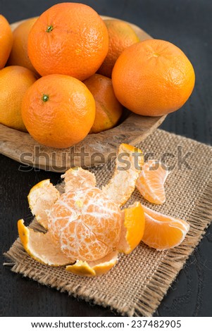 Still life with fresh mandarins in a wooden basket