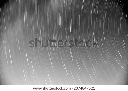 abstract long exposure of star trails in night sky