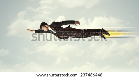Happy business man flying fast on the sky between clouds concept