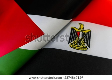 Background of the flags of the Egypt, palestine. The concept of interaction or counteraction between the two countries. International relations. political negotiations. Sports competition. Royalty-Free Stock Photo #2374867129
