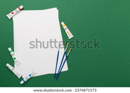 Painting tools on color background, top, view