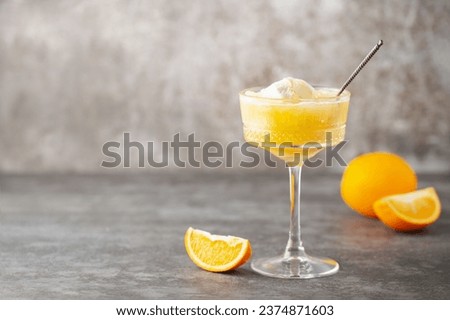 Homemade orange creamsicle in glass. Frozen orange juice with ice cream. Summer dessert. Copy space Royalty-Free Stock Photo #2374871603
