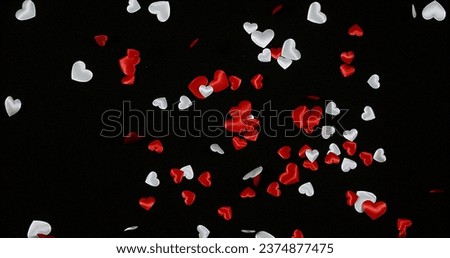 Hearts falling against Black Background for Saint Valentine's Day