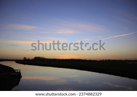 Pictures of sunsets in the Netherlands in different landscapes, from countryside, lake, ocean and during ice skating.
