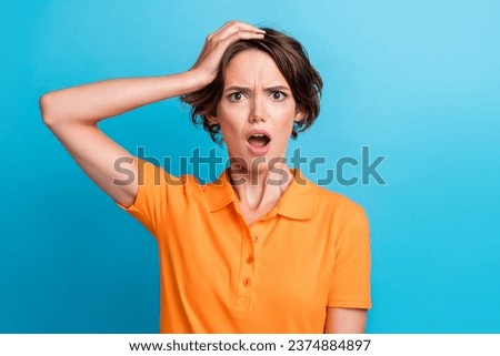 Photo of scared impressed lady wear orange t-shirt open mouth arm head isolated blue color background Royalty-Free Stock Photo #2374884897