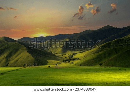 Panoramic view of beautiful countryside in the prairie of Inner Mongolia, China. Sunny afternoon. Wonderful spring landscape in the mountains. meadows and rolling hills. Royalty-Free Stock Photo #2374889049