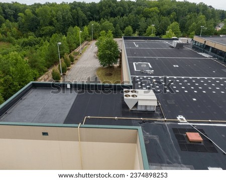 Commercial Roof Inspection By Drone Royalty-Free Stock Photo #2374898253