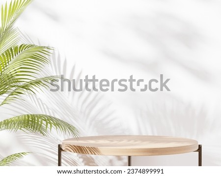 Wooden round table with plant leaf and beautiful sun light and shadow on beige wall for luxury beauty, organic, health, cosmetic, jewelry fashion product display background Royalty-Free Stock Photo #2374899991