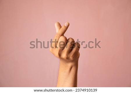 Finger heart. man hand with french manicure gesturing isolated on pink background Royalty-Free Stock Photo #2374910139