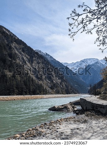 Scenic view of river flowing through valley