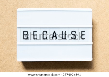 Lightbox with word because on wood background