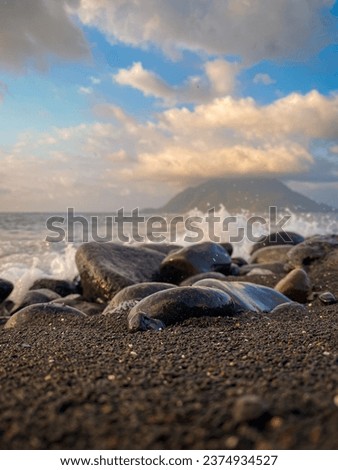 View of beautiful beach shore. Mountain view and blue sky.