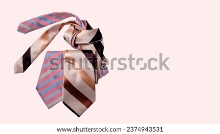 90s style - pair of men's silk ties, large stripes, pastel colors, beige background, banner concept