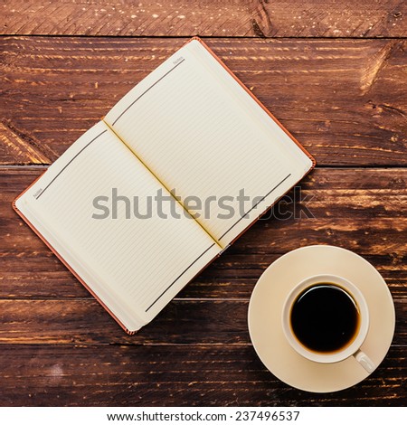 Coffee cup and book on wooden background - Vintage effect style pictures