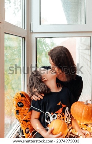 mom and daughter have fun during halloween celebration