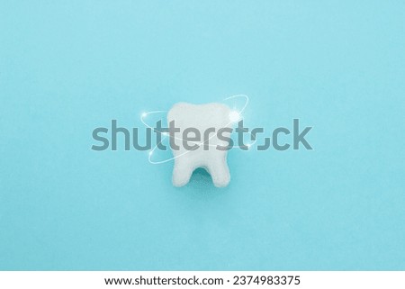 Protective vortex around tooth model on blue , teeth will good healthy.