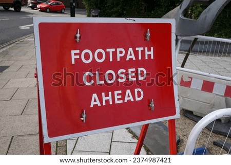 Footpath closed ahead sign on pavement in city. repair works to slabs on sidewalk 
