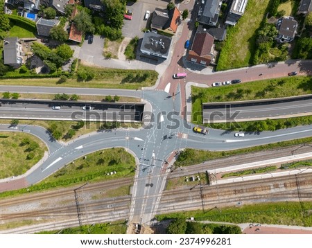 Top view picture of intersection in dieren with underpass, railroad crossing and some houses