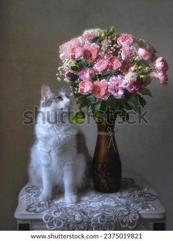 Portrait of cute cat with bouquet delicate flowers