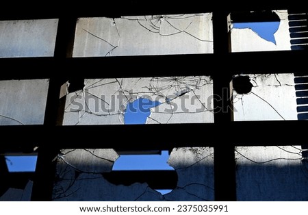Abandoned cracked windows in old building