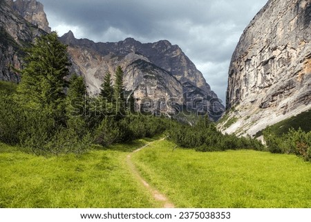 Valley Val Travenanzes and path way rock face in Tofane gruppe, Alps Dolomites mountains, Fanes national park, Italy Royalty-Free Stock Photo #2375038353