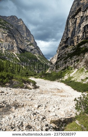 Valley Val Travenanzes and path way rock face in Tofane gruppe, Alps Dolomites mountains, Fanes national park, Italy Royalty-Free Stock Photo #2375038597