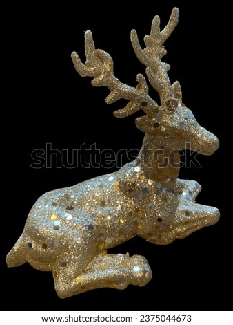 Glitter reindeer christmas gift and isolated black background. Artificial Christmas Glitter reindeer.