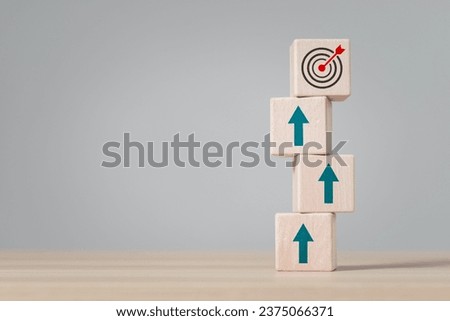 Successful business growth concept. wooden block with target icon and arrow aim to target. business development, business plans and strategies, investment and growth.