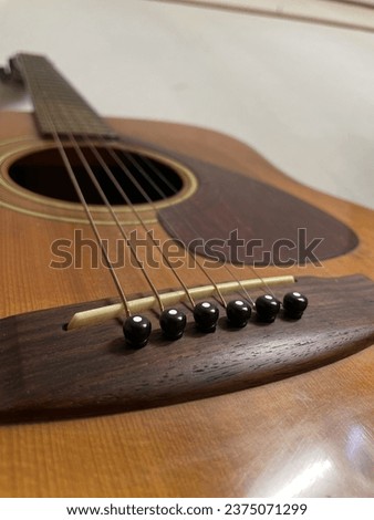 a guitar hanging on the wall