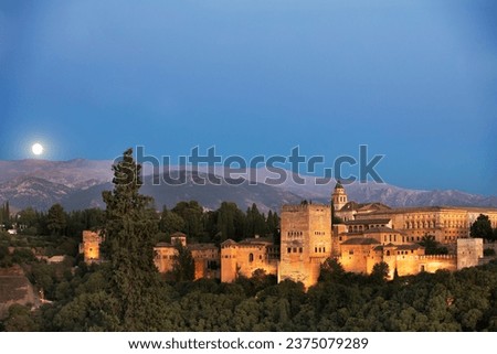 Ancient arabic fortress Alhambra at the beautiful evening time, Granada, Spain, European travel landmark