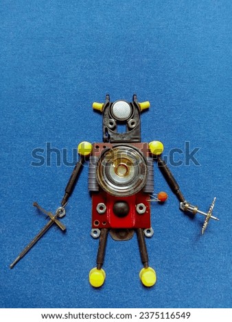 game watch components and walker clock machine components arranged to resemble robot characters
